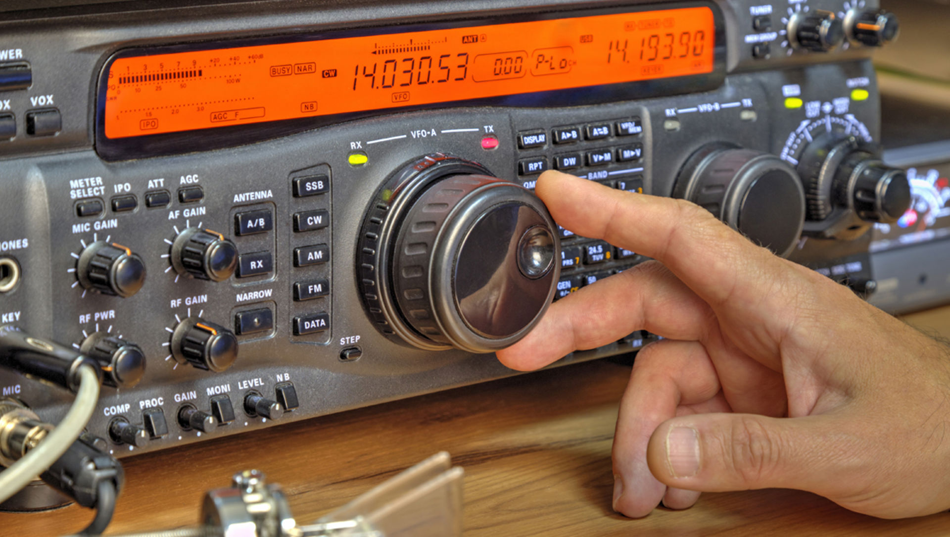 someone using a high frequency radio amateur transceiver