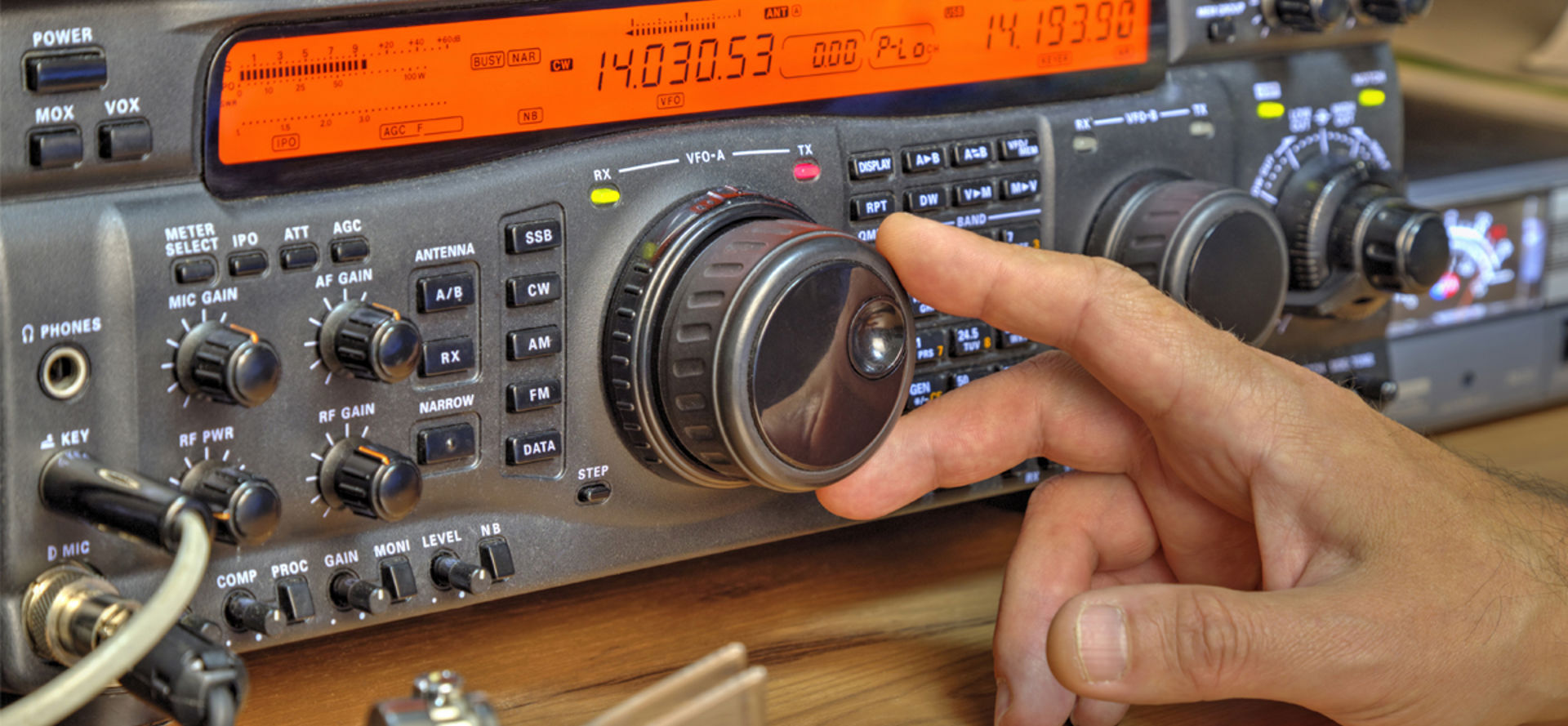 someone using a high frequency radio amateur transceiver
