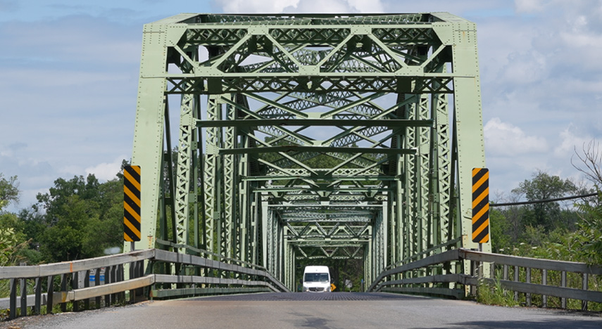 Two lane truss metal bridge in rural New York state