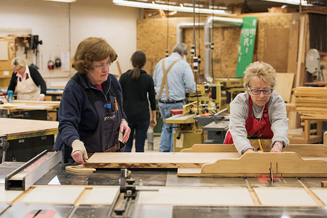 People working with wood in a workshop