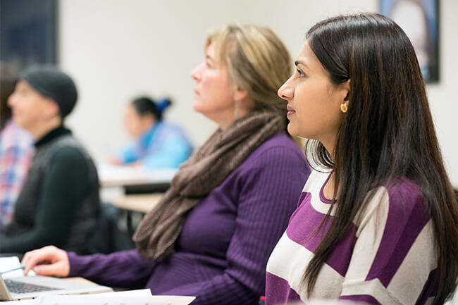 Students sitting in a classroom watching the instructor