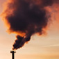 Smoke pouring out of a smokestack