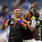 Aston Villa's Emiliano Martinez (left) and Aston Villa's Morgan Rogers (right) celebrates with the fans after the Premier League match at the King Power Stadium, Leicester. Picture date: Saturday August 31, 2024. PA Photo. See PA story SOCCER Leicester.