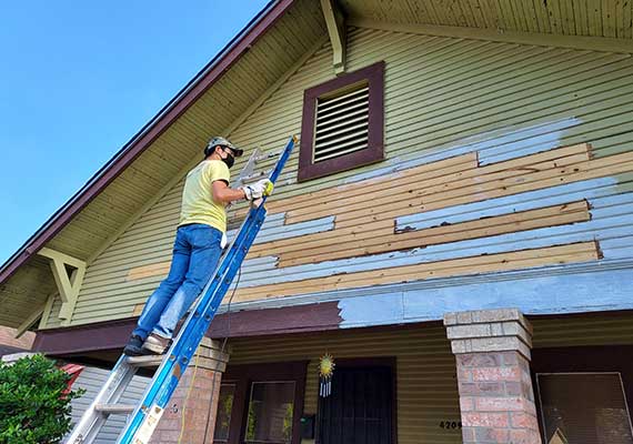 Reliant helping the community fixing a house