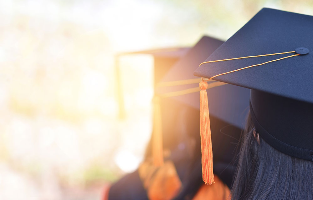 Graduation day with caps and gowns in the sun