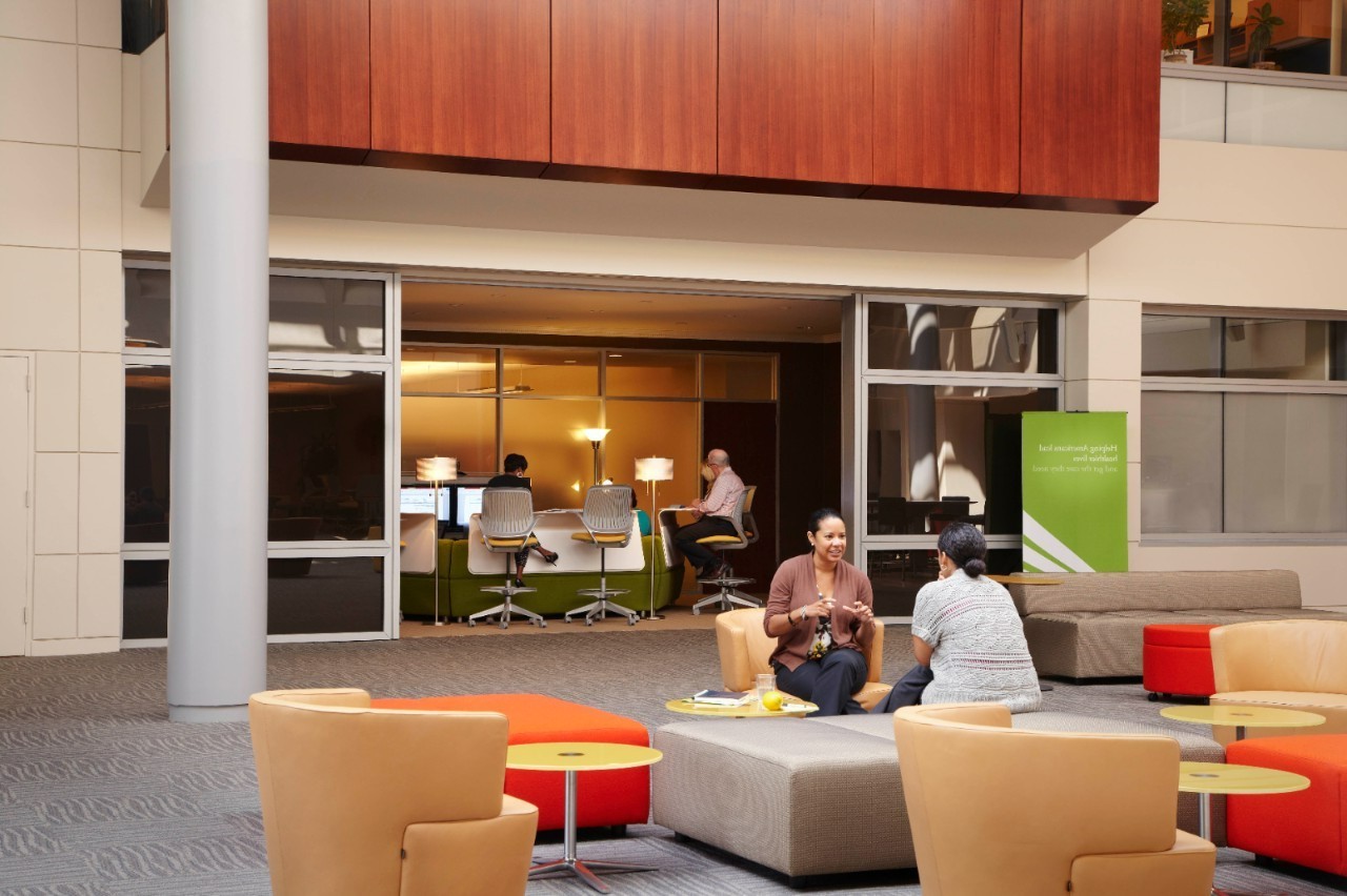 People sitting in an atrium at the RWJF headquarters.