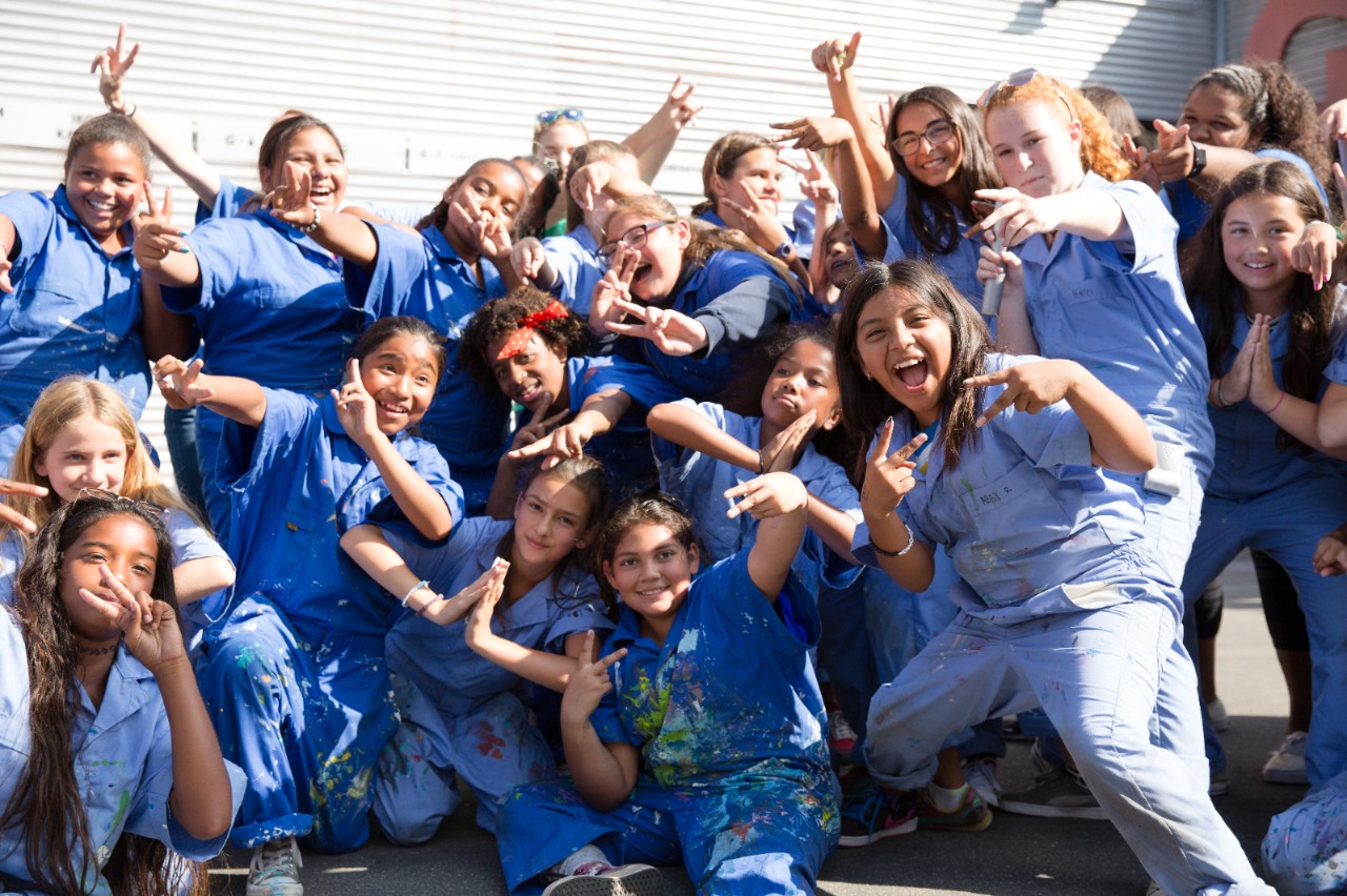 Happy girls posing for group photo.