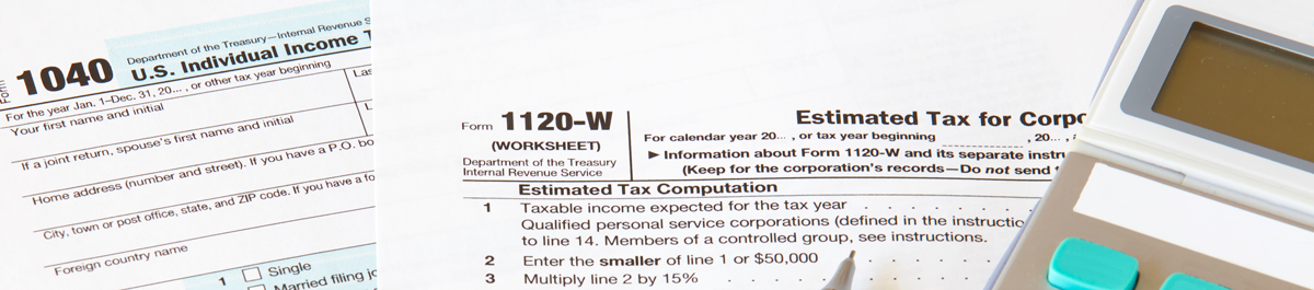 Tax forms with pen and calculator