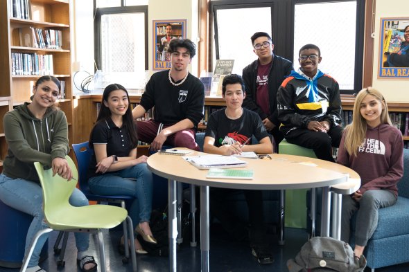 Balboa High School students smiling and staring at a camera