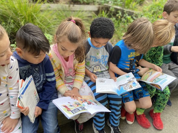 First grade students sitting reading