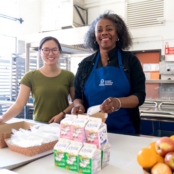 Staff prepare school meals