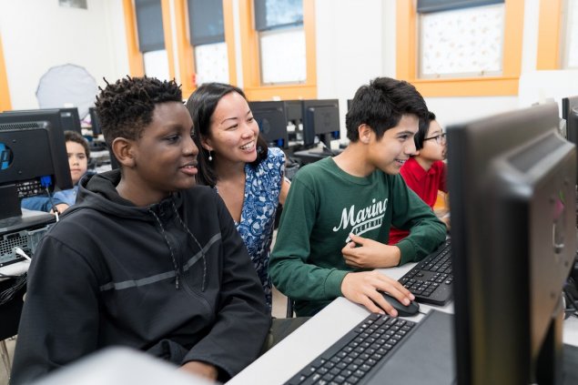 Students and teacher using technology