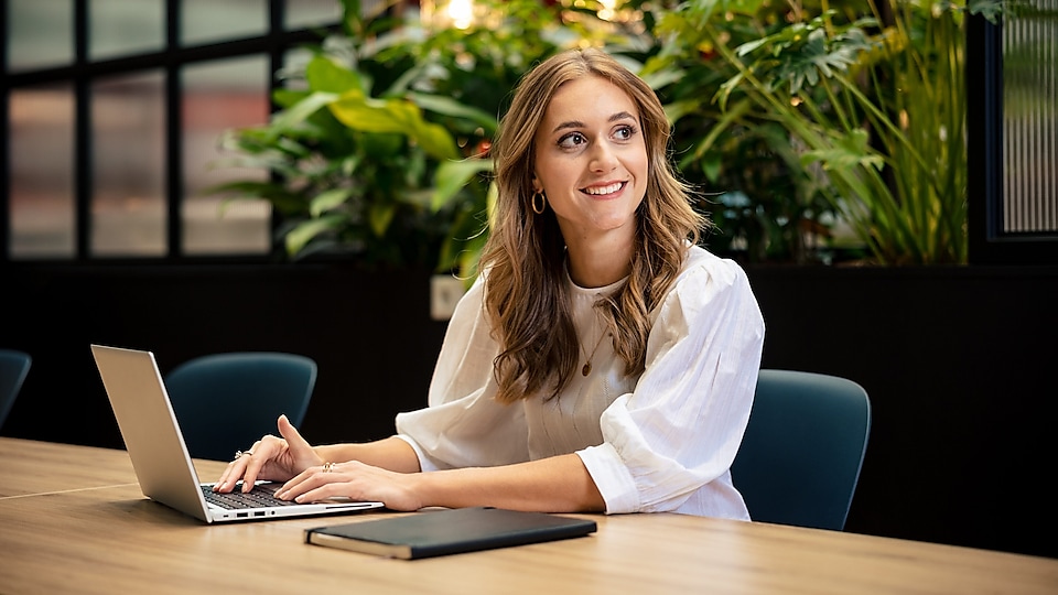 employee working on her laptop