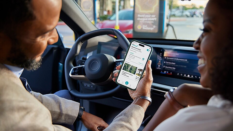 women using phone in car