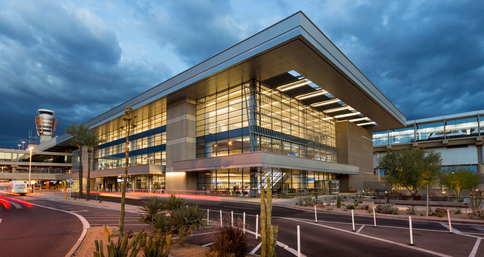 Exterior of a Sky Harbor Airport Terminal with a cloudy sky. 