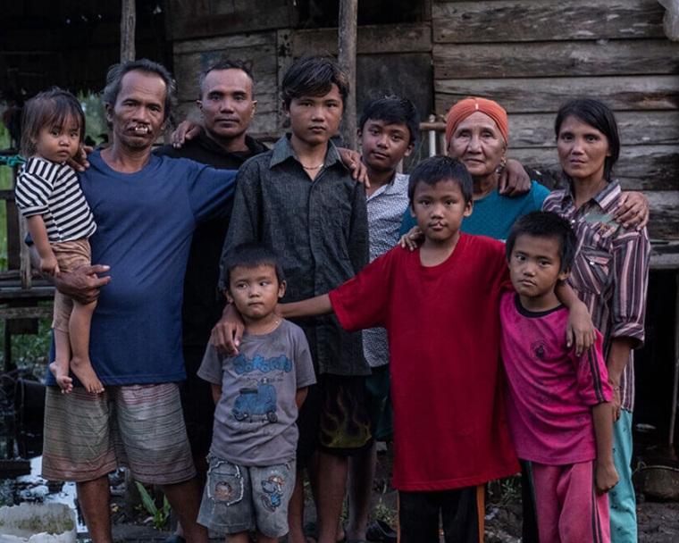 Alim and Rajib smiling with their family before cleft surgery