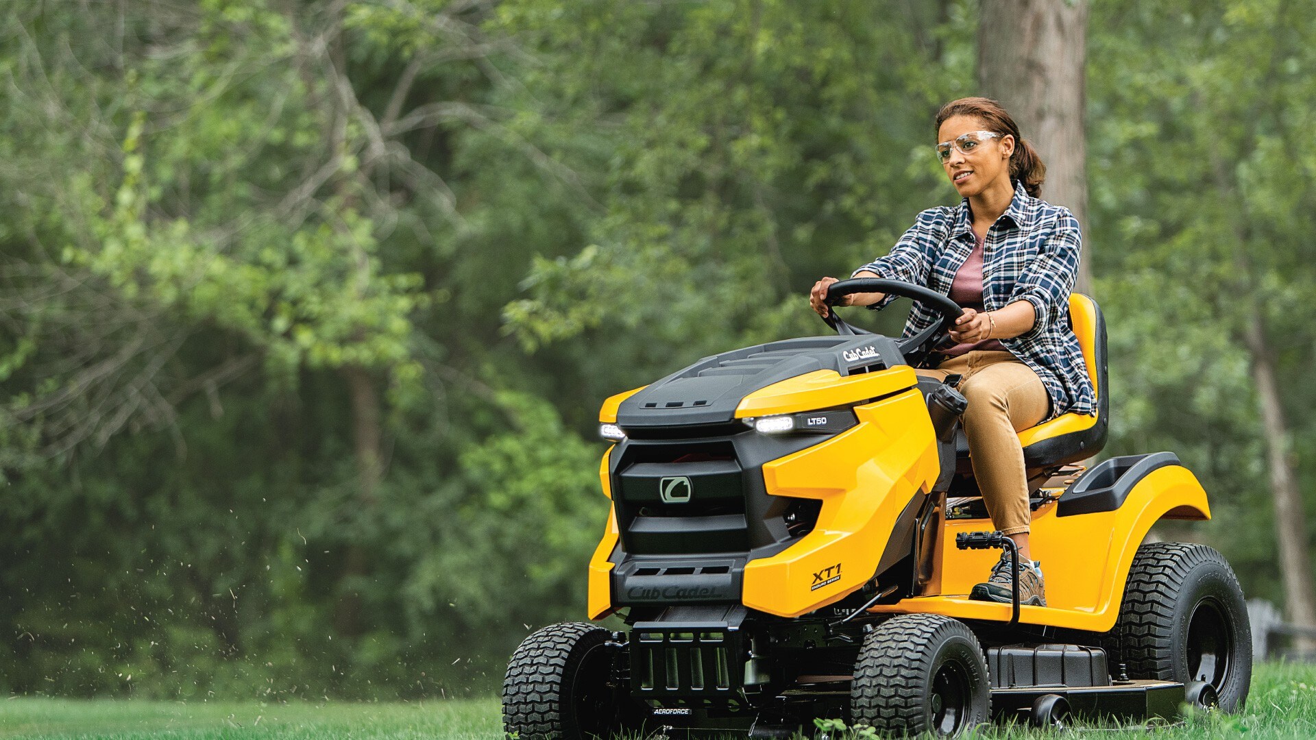 Woman on a Cub Cadet mower