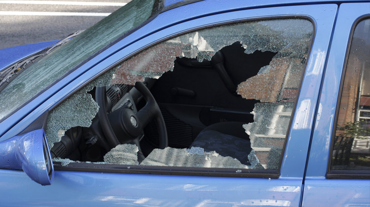 Car with window smashed.