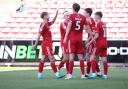 Swindon celebrate their fourth goal against Newport