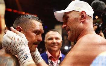 Tyson Fury hugs Oleksandr Usyk