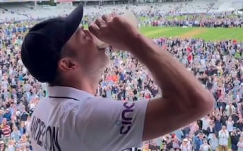 James Anderson necks a pint of Guinness on the Lord's balcony