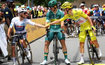 Tadej Pogacar and Remco Evenepoel shake hands ahead of the start