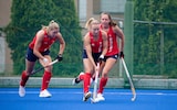 Woman in Team GB practising hockey 