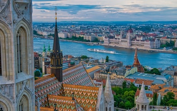 An aerial view of Budapest showing a Viking cruise ship on the Danube river 