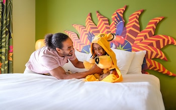 A father and child wearing a Lion King outfit at Disney's Art of Animation Resort