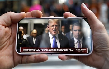 People watch the former US President at criminal court outside Trump Tower