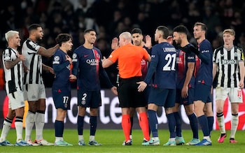 PSG players surround the referee during their draw with Newcastle