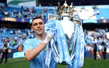 Phil Foden with the Premier League trophy