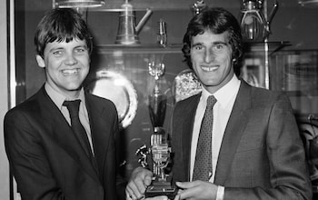 Radio City sports reporter Clive Tyldesley (left) receives the 'British Local Radio Award' from Liverpool goalkeeper Ray Clemence at Anfield in Liverpool, England, circa August 1980