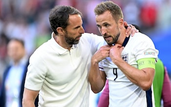 Gareth Southgate puts his arm around Harry Kane