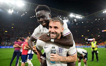 Bukayo Saka and Luke Shaw of England celebrate after the team's victory in the UEFA EURO 2024 semi-final match between Netherlands and England at Football Stadium