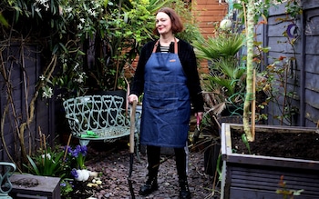 Writer Liz Hoggard in her garden at home