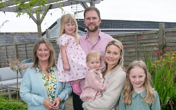 Kathie Hannam (left) shares a house with her son Alex Mearns, his wife Robyn Mearns and their daughters Lily (8), Elowyn (16 months) and Iris (5)