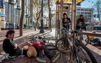 Drug users at a bus stop in California, US