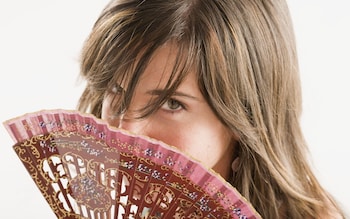 A woman with a fan