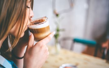 Woman drinks coffee