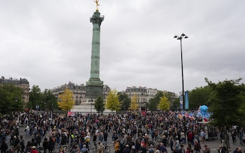 Protesters gather on Place de la Bastille during a demonstration against the far-right and racism in central Paris
