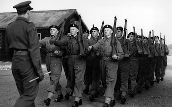 Black and white picture of men marching