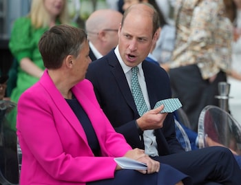 The Prince shows off his tie to Ms Jones, the Earthshot Prize chief executive