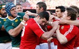 British Lions' Rob Kearney, center and Brian O'Driscoll, right, tussle with South Africa's Juan Smith during their international rugby union match at Loftus Versfeld stadium, Pretoria, South Africa, Saturday June 27, 2009