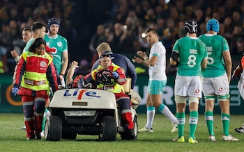 Craig Casey gives a thumbs up as he is driven off on a stretcher