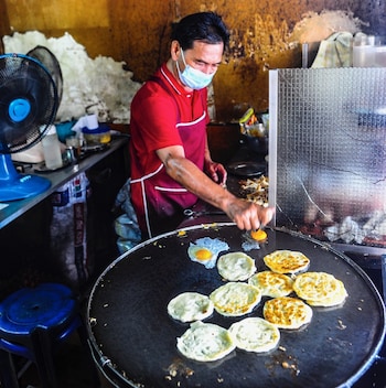 Person cooking Roti massaman