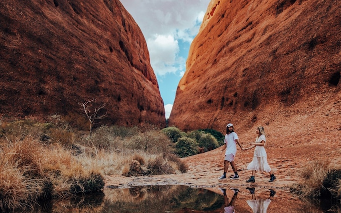 Visitors exploring Walpa Gorge at Kata Tjuta, Australia's Red Centre