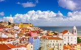 A view over Portugal's Alfama district, with the Tagus river behind