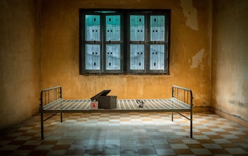 A steel bedframe in a torture and genocide museum in Phnom Penh, Cambodia