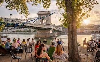 The hills of Buda rise over the western bank of the Danube